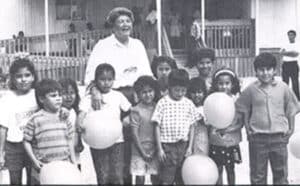 Caridad founder with children